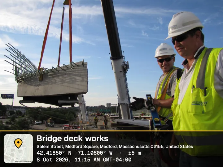 Construction inspectors beside a crane lifting a bridge section, with the Pro Report stamp: Bridge deck works, Medford, Massachusetts, coordinates with ±5 m accuracy